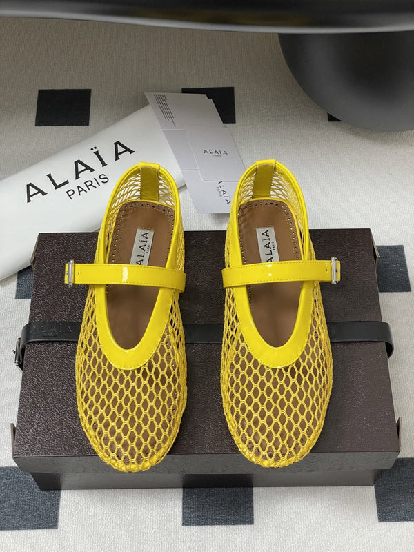 ALAIA BALLET FLATS IN YELLOW MESH FISHNET
